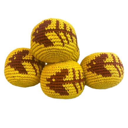 Four yellow and brown crocheted balls on a white background